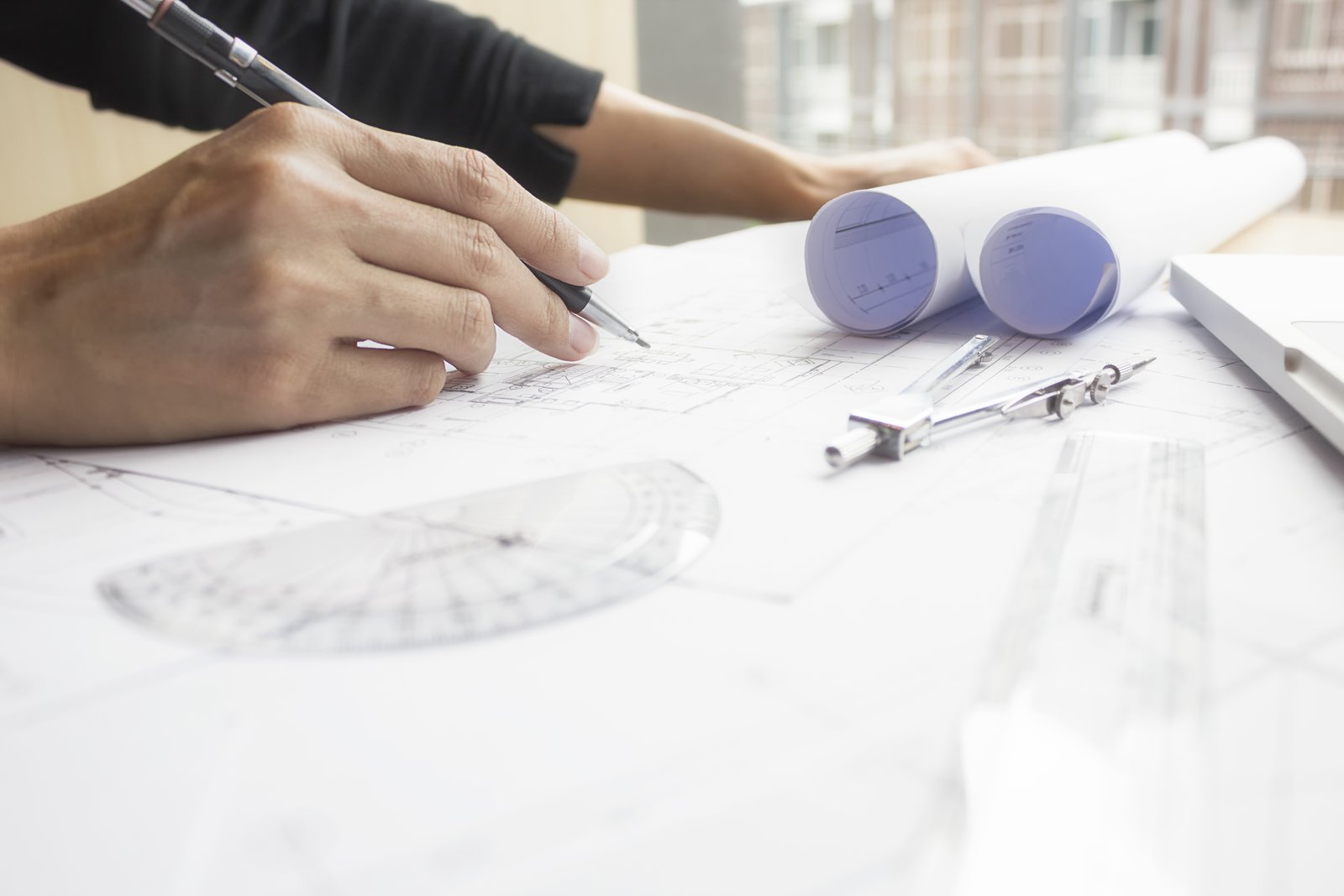 Engineer with blueprints